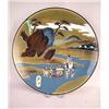 Image 1 : AN ORIENTAL STYLE CHARGER Depicting a river landscape of men carrying their Emperor across a river, 