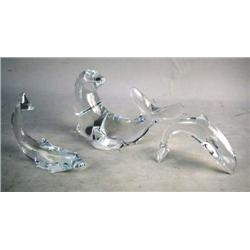 TWO BACCARAT JUMPING CRYSTAL PORPOISES From 5 1/2"l to 4 3/4"l, together with a Val St. Lambert colo
