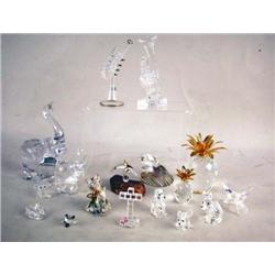 TWO SWAROVSKI CRYSTAL PINEAPPLES With gilt metal top, 2 1/4"h and 4 1/4"h, together with miniature c