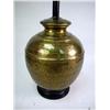 Image 5 : A LARGE BRASS LAMP WTH STRING SHADE Together with a round Oriental design black top brass table on t
