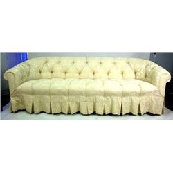 A COUCH Ivory colored upholstery with matching pillows, some wear, 8'1"l