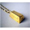 Image 2 : A 14K YELLOW GOLD CARTIER INGOT SUSPENDED FROM A GOLD CHAIN Apx. 26.5 dwt.