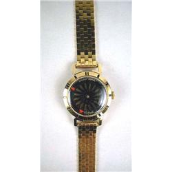 AN 18K ERNEST BOREL "MYSTERY" WATCH With a sapphire crystal, with attached bracelet, 18K watch & bra