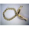 Image 1 : A 14K YELLOW GOLD CHARM BRACELET WITH DOUBLE HANGING FISH PENDANTS Apx. 14.5 dwt.