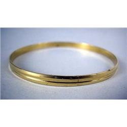 A 14K YELLOW GOLD BANGLE BRACELET Apx. 8.3 dwt.