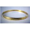 Image 1 : A 14K YELLOW GOLD BANGLE BRACELET Apx. 8.3 dwt.