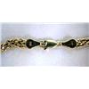 Image 2 : A 14K YELLOW GOLD CHARM BRACELET With broken link