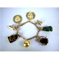 A 14K YELLOW GOLD CHARM BRACELET With tiger eye B