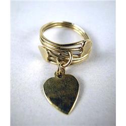 A 14K YELLOW GOLD RING WITH TWO HEARTS One a pendant charm, together with a 14K gold band ring