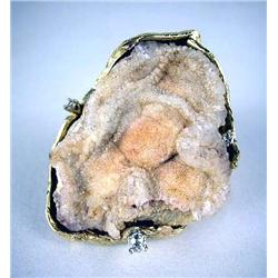 A 14K YELLOW GOLD LADY'S RING SET WITH A ROUGH CRYSTAL STONE Set with three circular diamonds, total