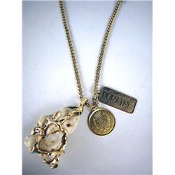 A GOLD NECKLACE WORN BY DIZZY GILLESPIE Comprisin