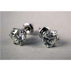 A PAIR OF 14K WHITE GOLD DIAMOND STUD EARRINGS Each set with a round brilliant cut diamond, each wei