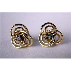 A PAIR OF 14K YELLOW GOLD AND DIAMOND EARRINGS Comprising three interlocking circles, each set with 