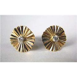 A PAIR OF 14K YELLOW GOLD DISC STYLE EARRINGS Each set with a circular full cut diamond, total estim