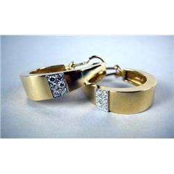 A PAIR OF 14K YELLOW GOLD HOOP STYLE EARRINGS Apx. 9.10 dwt, with twelve full cut diamonds, total es