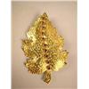 Image 1 : AN 18K YELLOW GOLD LEAF FORM BROOCH Stamped 18K, with ten natural rubies, total estimated weight apx