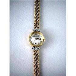 A LADY'S 14K YELLOW GOLD JAEGER LACOULTRE WATCH W