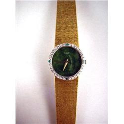 A 18K YELLOW GOLD LADY'S PIAGET WATCH AND BRACELE
