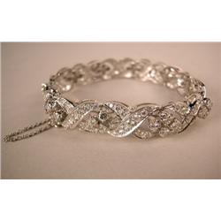 A DIAMOND AND PLATINUM BRACELET Comprising "X" style links set with 170 circular diamonds, total est
