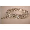 Image 1 : A DIAMOND AND PLATINUM BRACELET Comprising "X" style links set with 170 circular diamonds, total est