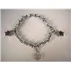 Image 1 : A 14K WHITE GOLD BRACELET WITH THREE CHARMS One o