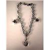 Image 2 : A 14K WHITE GOLD BRACELET WITH THREE CHARMS One o