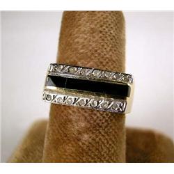 A 14K YELLOW GOLD, ONYX, AND DIAMOND RING With fourteen single cut diamonds, total estimated weight 