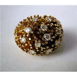 A 14K YELLOW DOMED GOLD RING With fourteen full cut circular diamonds, total estimated weight apx. 0