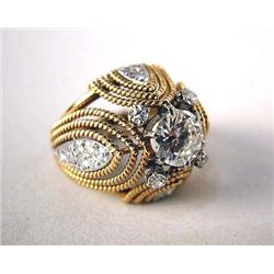 A 14K YELLOW GOLD AND DIAMOND DOMED RING With one