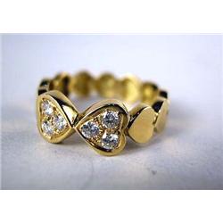 A 14K YELLOW GOLD AND DIAMOND HEART SHAPED RING With six circular full cut diamonds, total estimated