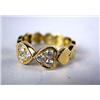 Image 1 : A 14K YELLOW GOLD AND DIAMOND HEART SHAPED RING With six circular full cut diamonds, total estimated