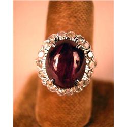 A 14K WHITE GOLD, RUBY AND DIAMOND RING Comprised