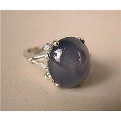 A STAR SAPPHIRE AND DIAMOND PLATINUM RING With na