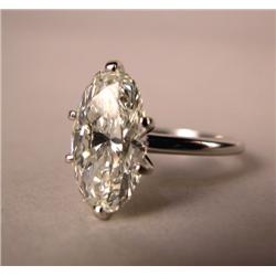 ONE DIAMOND AND PLATINUM RING: Stamped 10% Irid Plat, with center oval shaped diamond,