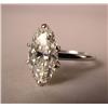 Image 1 : ONE DIAMOND AND PLATINUM RING: Stamped 10% Irid Plat, with center oval shaped diamond,
