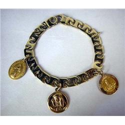 A 14K YELLOW GOLD, GOLD LINK BRACELET With three 14K gold religious medals, two circular and one ova
