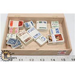 12X100 LOT CATALOGUED CANADIAN STAMPS IN CIGAR BOX