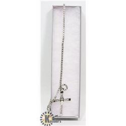 SILVER-TONED CROSS PENDANT.