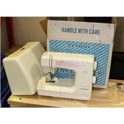 JANOME SEWING MACHINE WITH CABINET.