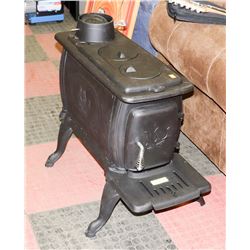 CAST IRON LOG WOOD STOVE, 6" PIPE REQUIRED,