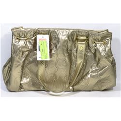 MICHAEL KORS GOLD TONED PURSE WITH TAGS.