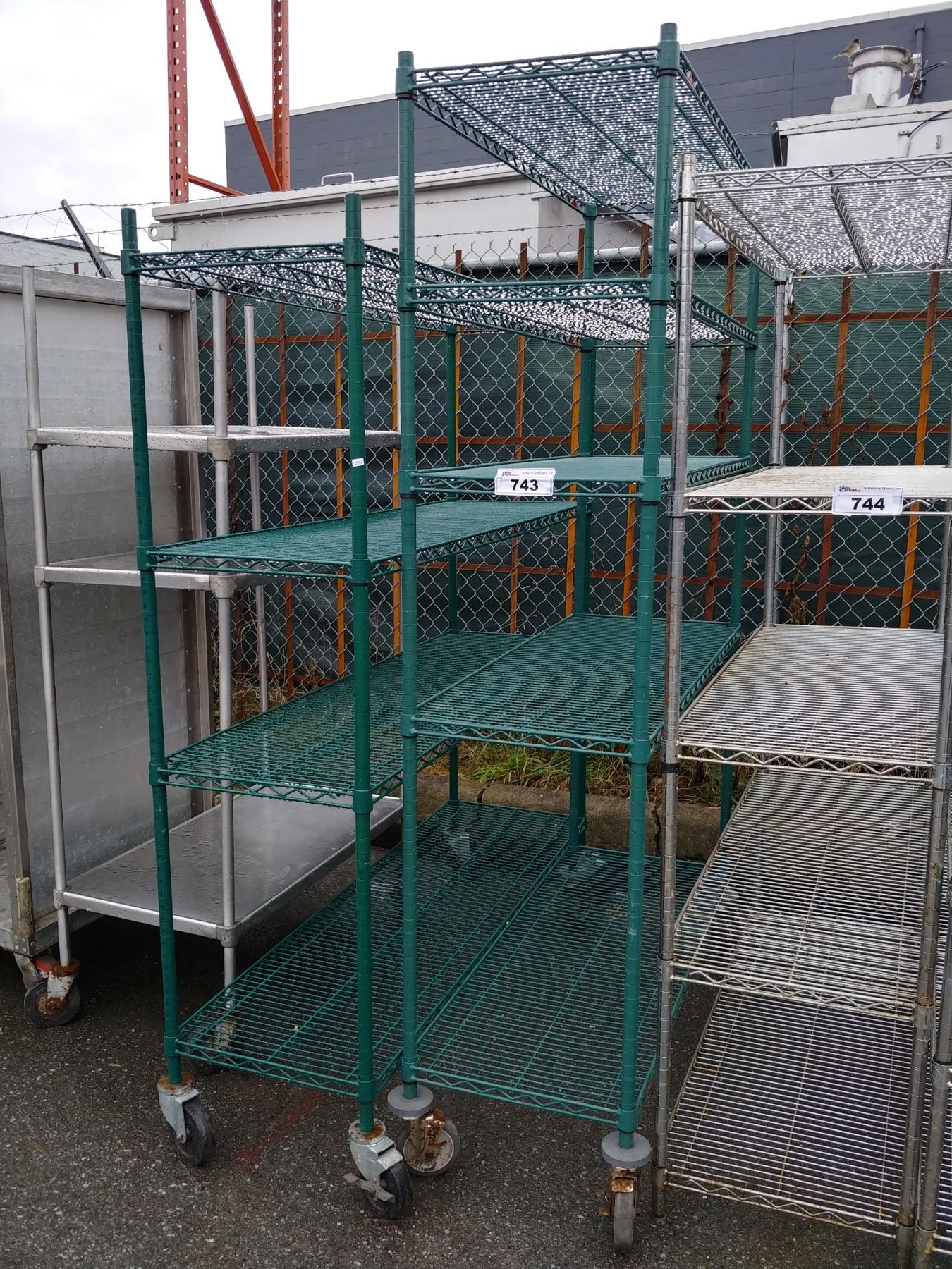 PAIR OF GREEN METAL ROLLING RACKS - Able Auctions