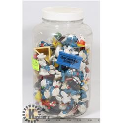 JAR OF ASSORTED VINTAGE SMURF FIGURINES.