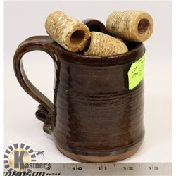 CLAY SHAVING MUG FULL OF ANTIQUE PIPES.