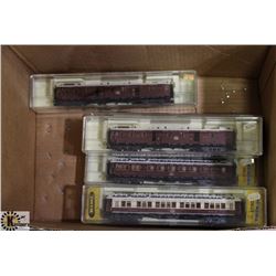 BOX OF TRIX INTERNATIONAL TRAIN CARS. HO SCALE.