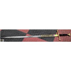 EMBOSSED SPANISH SWORD WITH GOLD TONE TRIM.