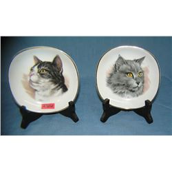 Pair of cat decorated dishes with stands