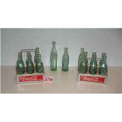 Collection of Coca Cola bottles and 2 early carriers