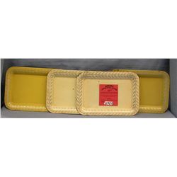 Group of four vintage cream colored serving trays