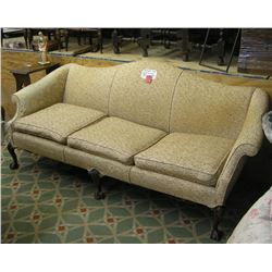 Antique sofa with carved ball and claw feet